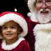 A young one sits on Sant'a lap after the Sing Along With Santa Event on Saturday. Daniel Brenner I AnnArbor.com